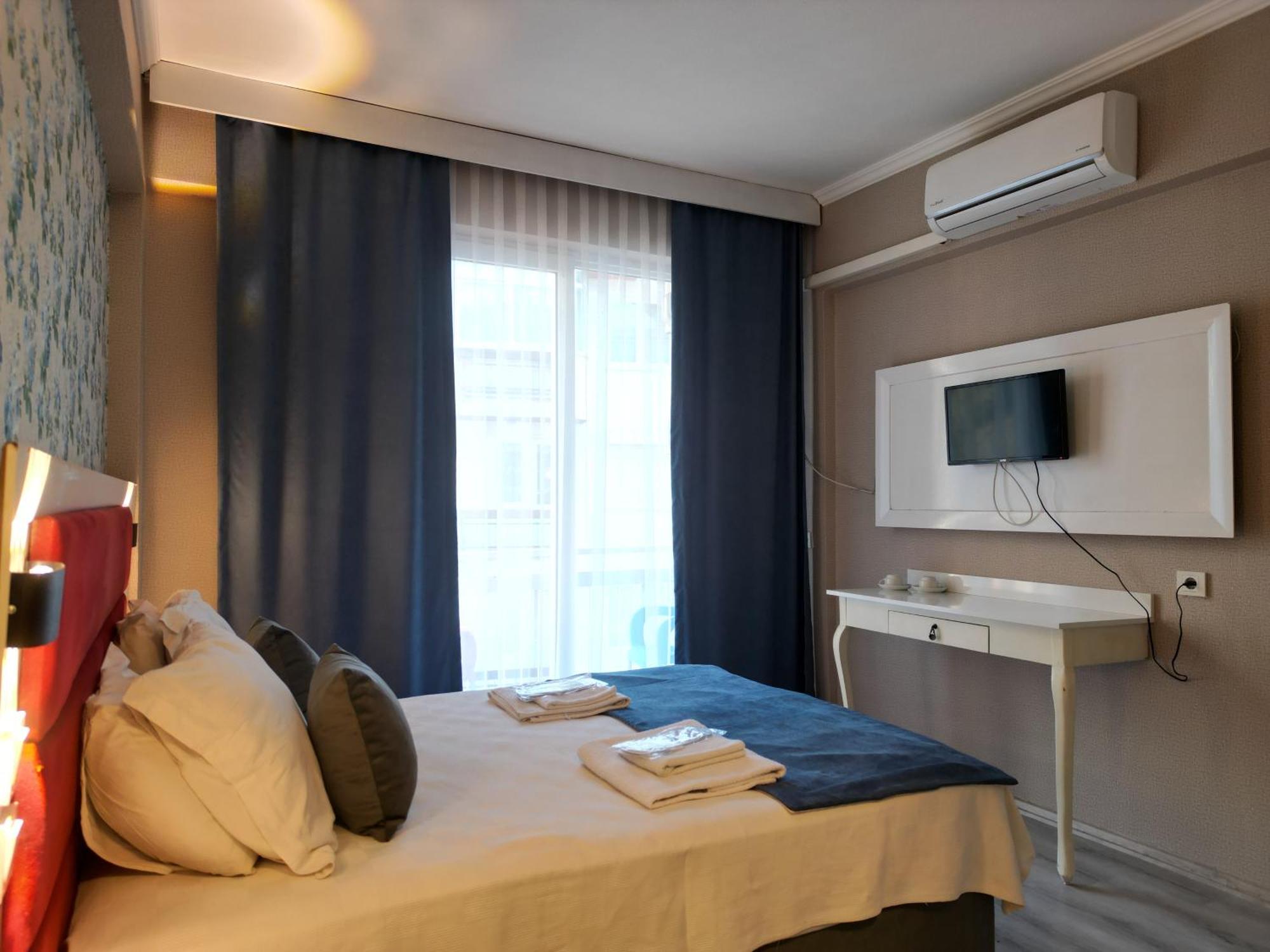 Akman City Hotel Кушадасы Экстерьер фото